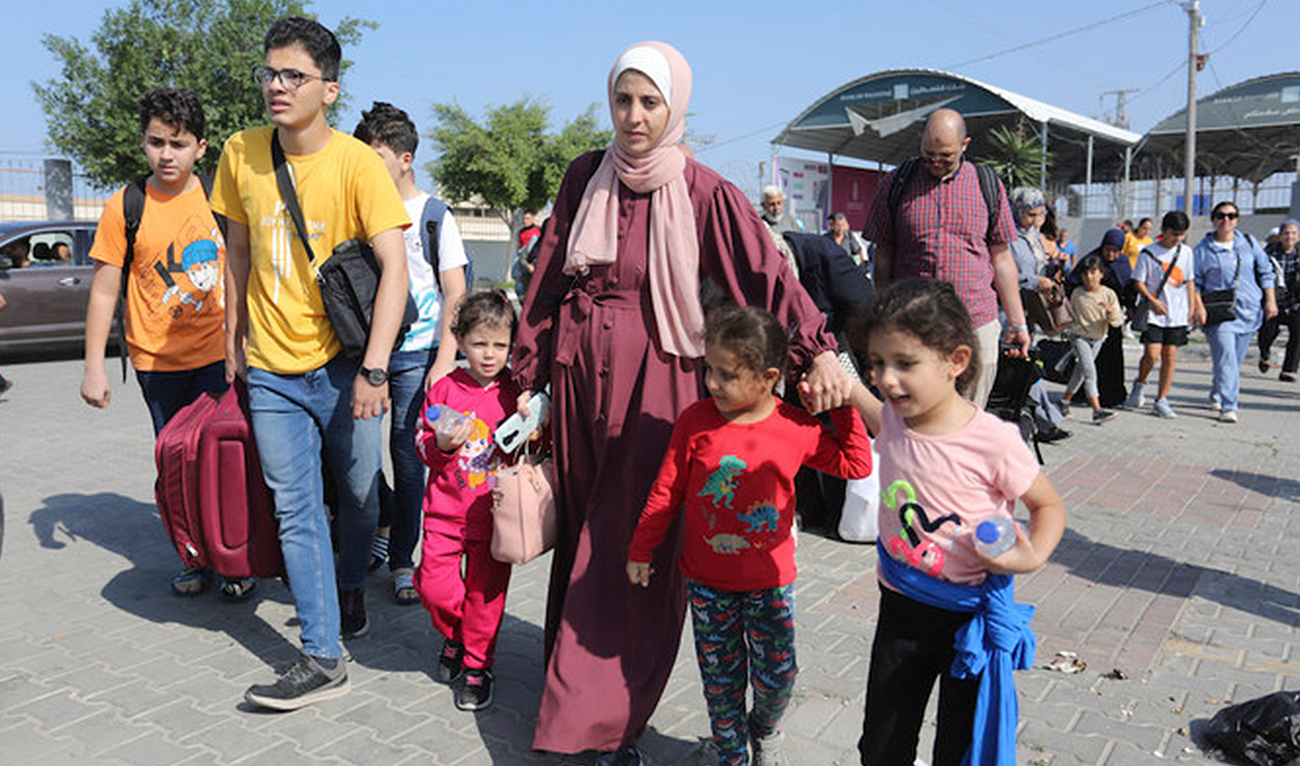 Palestinians cross to the Egyptian side of the border with the Gaza Strip at Rafah crossing on Nov. 1, 2023. (AP)