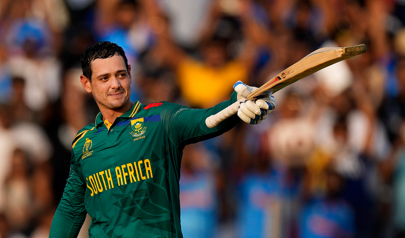 South Africa's wicketkeeper Quinton De Kock celebrates his century during the ICC Men's Cricket World Cup match between New Zealand and South Africa, in Pune, India, Wednesday, Nov. 1, 2023. (AP)