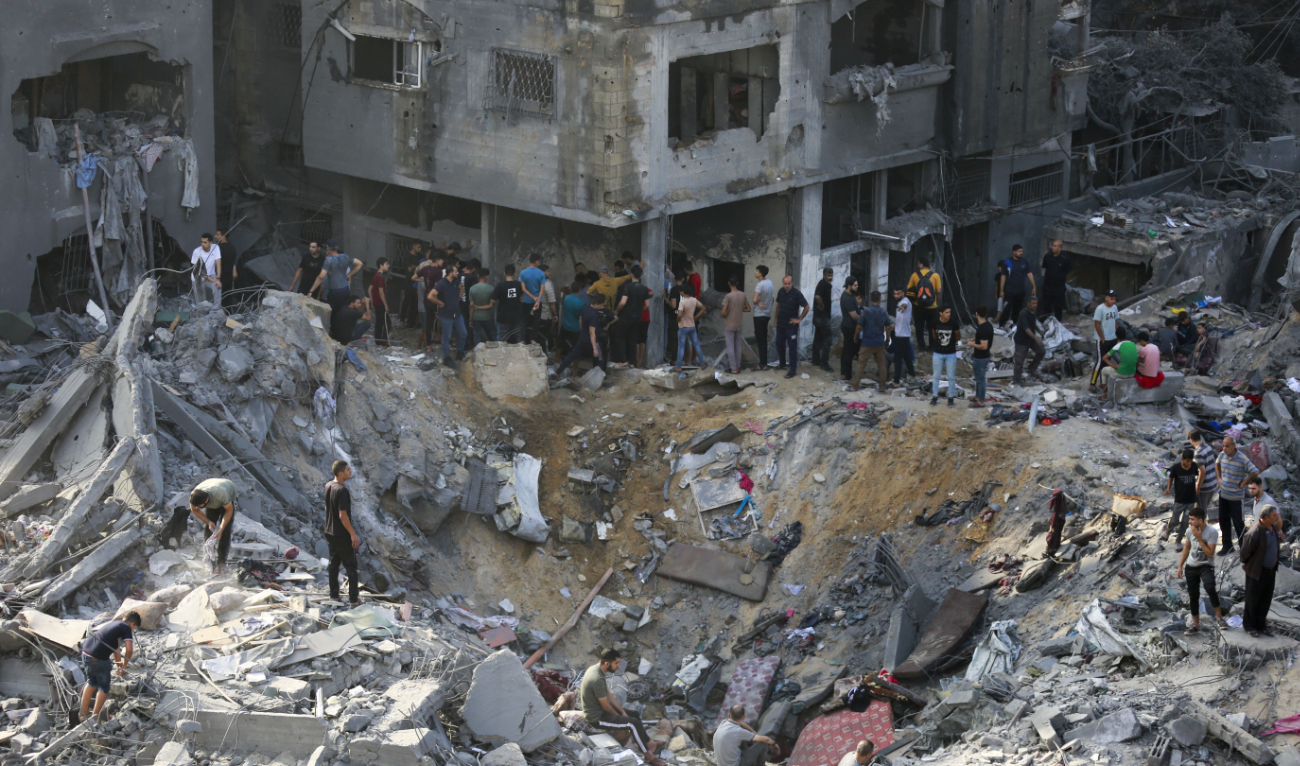 Palestinians check the destruction in the aftermath of an Israeli strike the previous night in the Jabalia camp for Palestinian refugees in the Gaza Strip, on November 1, 2023, amid ongoing battles between Israel and the Palestinian Hamas movement. (AFP)