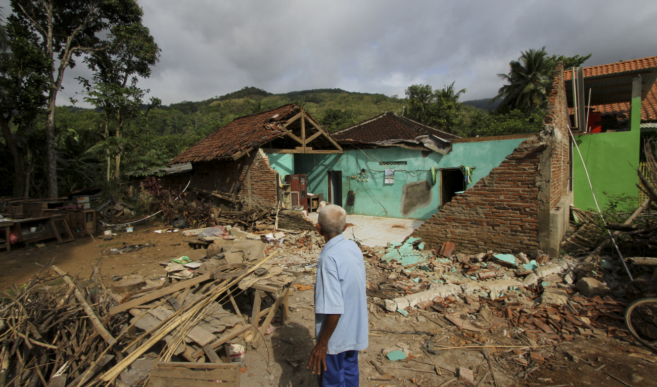 A villager looks at his damaged house at Ndelikan village in Wonogiri regency on July 1, 2023, a day after a magnitude 5.8 earthquake hit the area. (AFP/File)