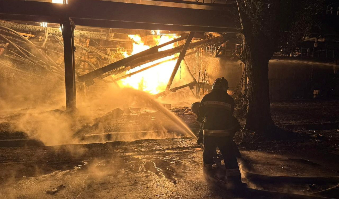 Firefighters work at an oil refinery which was hit during Russia’s drone attacks in Kremenchuk, Poltava region, Ukraine, on November 1, 2023. (Reuters)