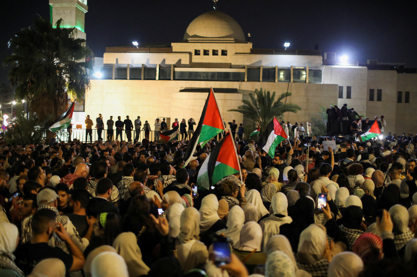 Jordanians gather during a protest in support of Palestinians in Gaza, amid the ongoing conflict between Israel and the Palestinian Islamist group Hamas, in Amman (Reuters)