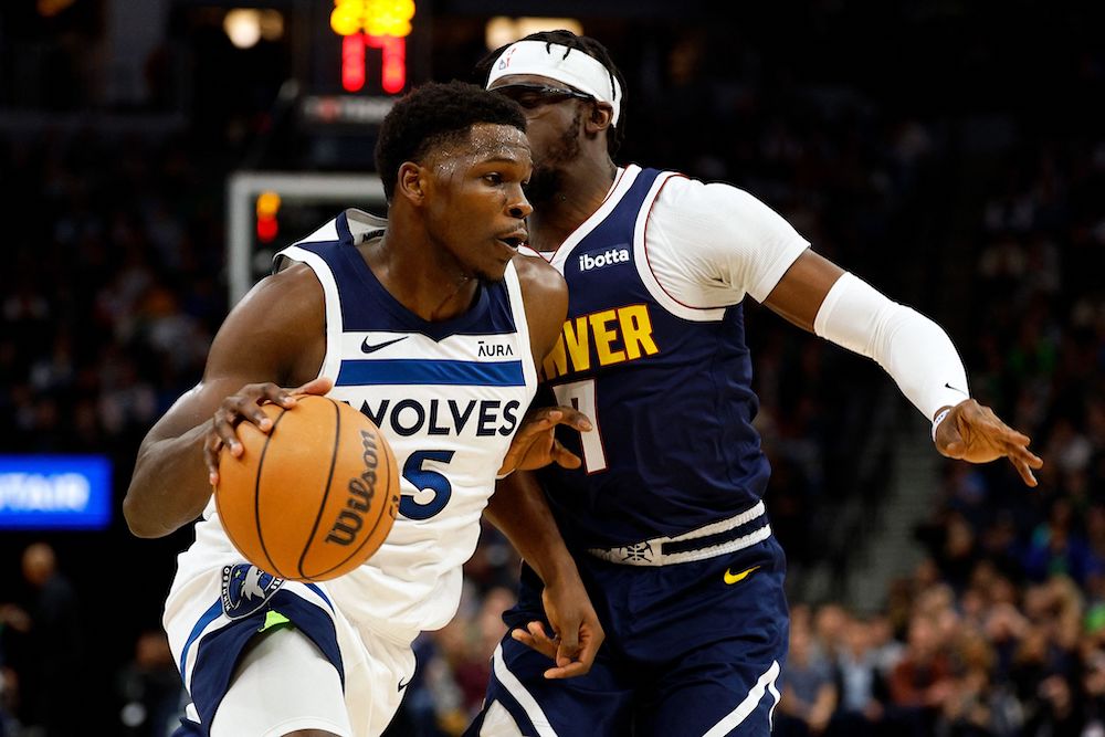 Anthony Edwards of the Minnesota Timberwolves drives to the basket past Reggie Jackson of the Denver Nuggets in first quarter NBA action at Target Center on Wednesday in Minneapolis, Minnesota. (Getty Images North America/AFP)