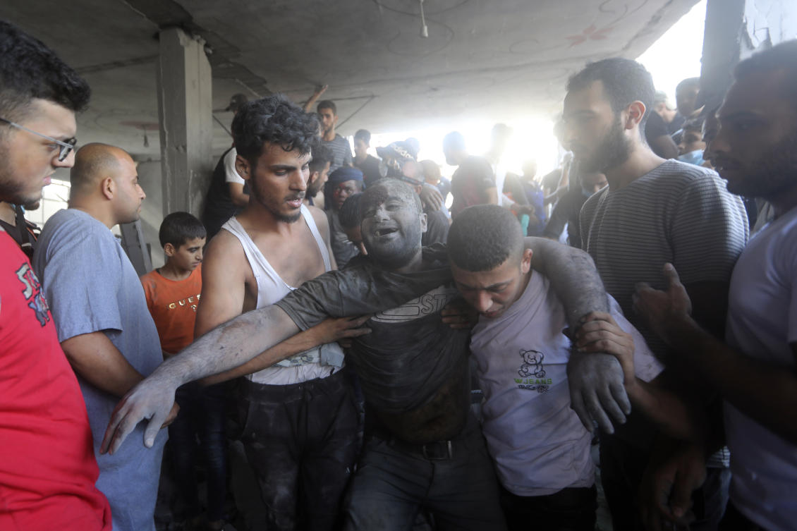 A Palestinian man reacts after being rescued from under the rubble of a destroyed building following an Israeli airstrike in Bureij refugee camp, Gaza Strip, on Nov. 2, 2023. (AP)