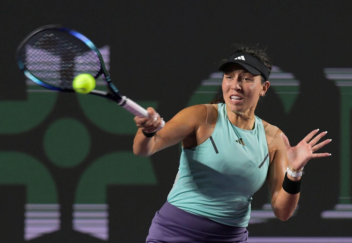 Jessica Pegula of the US returns the ball to Greece's Maria Sakkari during a women's singles match at the WTA Finals tennis championships in Cancun, Mexico, Thursday (AFP)