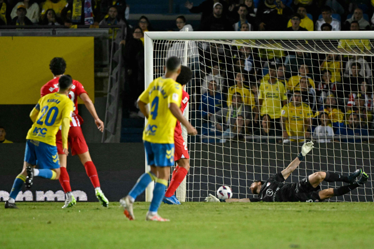 Las Palmas' Spanish midfielder #20 Kirian Rodriguez scores the opening goal during the Spanish league football match between UD Las Palmas and Club Atletico de Madrid at the Gran Canaria stadium in Las Palmas de Gran Canaria on Friday. (AFP)