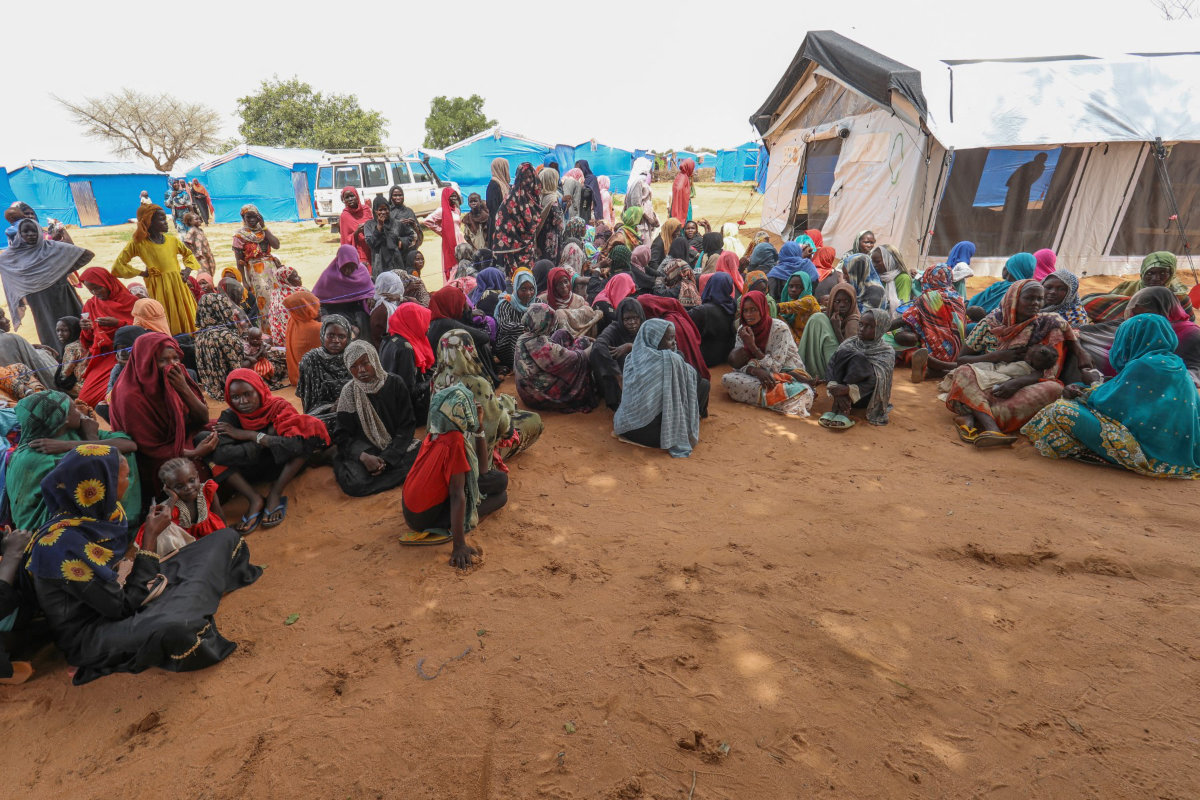 Women who fled the war in Sudan await the distribution of international aid rations at the Ourang refugee camp, near Adre town in eastern Chad on August 15, 2023. The Joint Human Rights Office in Sudan says it has received credible reports of more than 50 incidents of sexual violence linked to the conflict. (AFP)