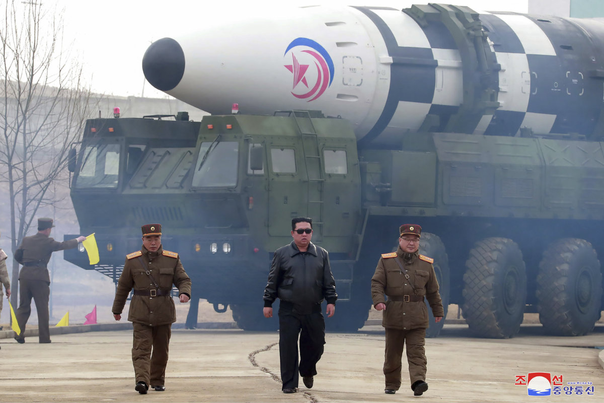 North Korean leader Kim Jong Un, center, walks around what a Hwasong-17 intercontinental ballistic missile (ICBM) on the launcher at an undisclosed location in North Korea on March 24, 2022. (Korean Central News Agency/via AP, File)