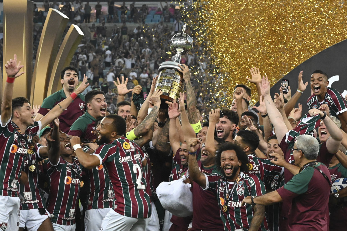 Players of Brazil's Fluminense celebrate with the trophy after winning the Copa Libertadores final soccer match against Argentina's Boca Juniors at Maracana stadium in Rio de Janeiro, Brazil, on Saturday. (AP)