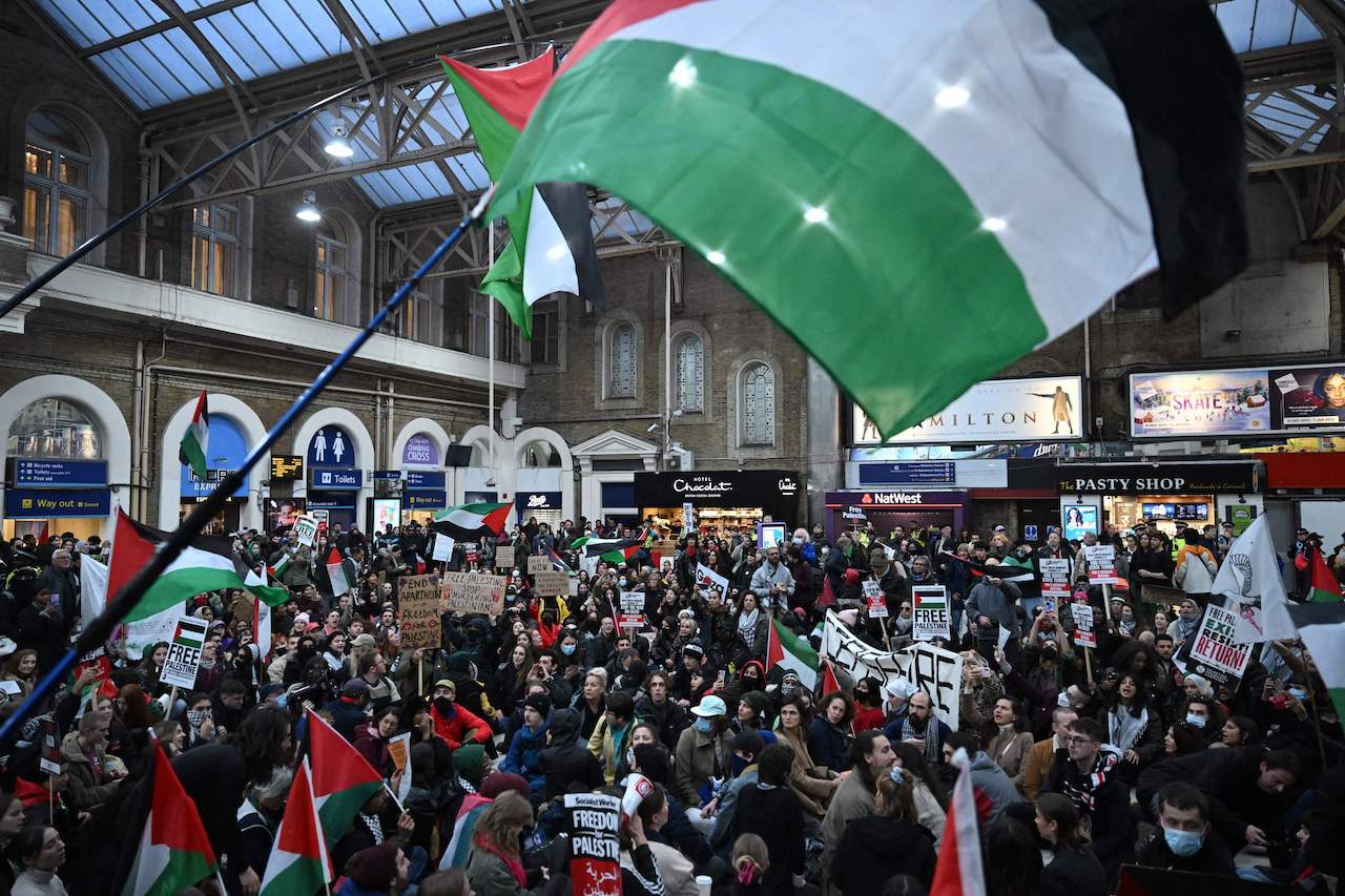 Demonstrators take part in a protest inside Charing Cross station following the 'London Rally For Palestine', in central London on November 4, 2023. (AFP)