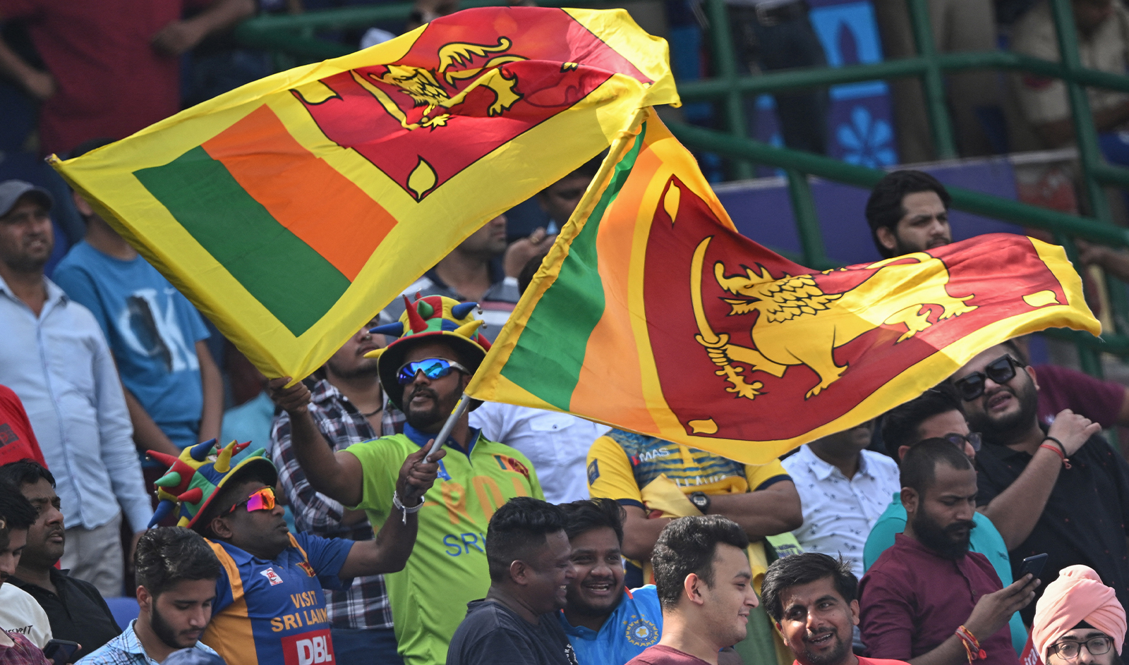 Sri Lanka's fans wave national flags during the 2023 ICC Men's Cricket World Cup one-day international (ODI) match between South Africa and Sri Lanka at the Arun Jaitley Stadium in New Delhi, India, on October 7, 2023. (AFP/File)