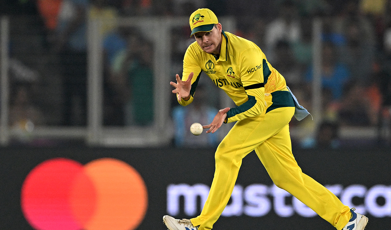 Australia's Steve Smith fields the ball during the 2023 ICC Men's Cricket World Cup one-day international (ODI) match between England and Australia at the Narendra Modi Stadium in Ahmedabad on November 4, 2023. (AFP)