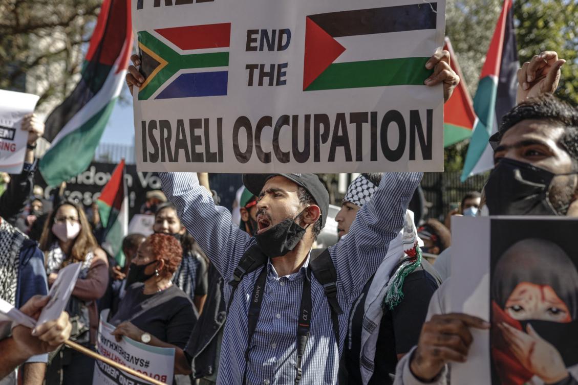 Demonstrators gather outside of the Israel Trade office in Sandton, Johannesburg, on May 11, 2021 during a protest against Israeli attacks on Palestinians in Gaza. (File/AFP)