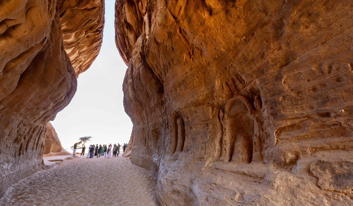 Tourists visit the Nabataean archaeological site of al-Hijr (Hegra), near the northwestern Saudi city of al-Ula, on January 31, 2022. (AFP)