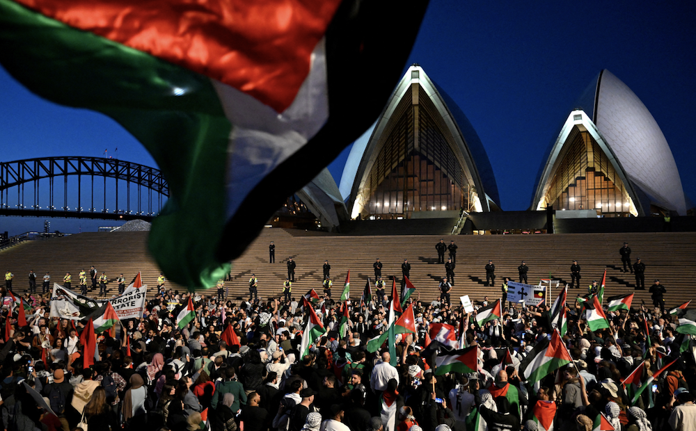 Participants of a pro-Palestinian rally react outside the Sydney Opera House in Sydney, October 9, 2023. (AAP Image/Dean Lewins via Reuters)