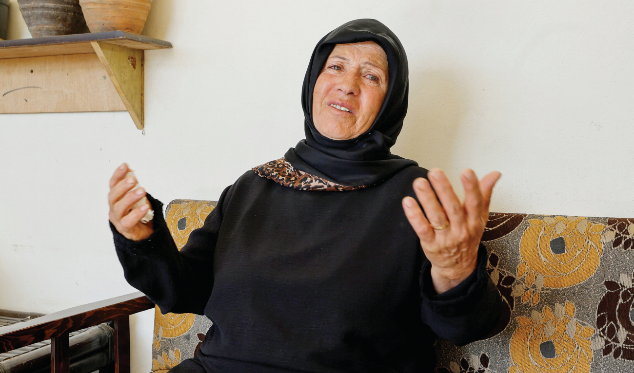Kamila Ayoub mourns her sister and her granddaughters at her house in Lebanon on Monday. (Reuters)