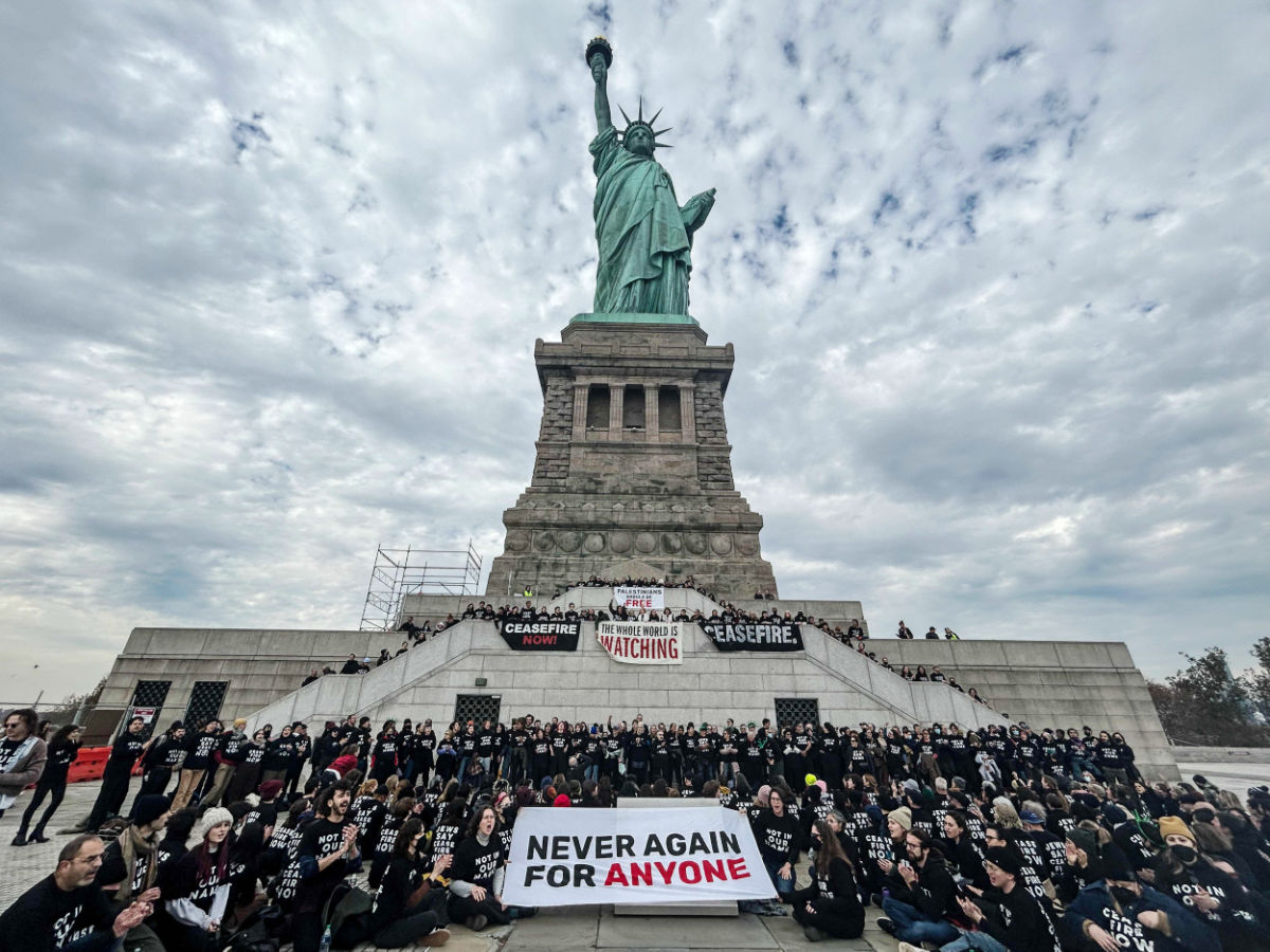 Activists from Jewish Voice for Peace occupy the pedestal of the Statue of Liberty on November 6, 2023 in New York City. (AFP)