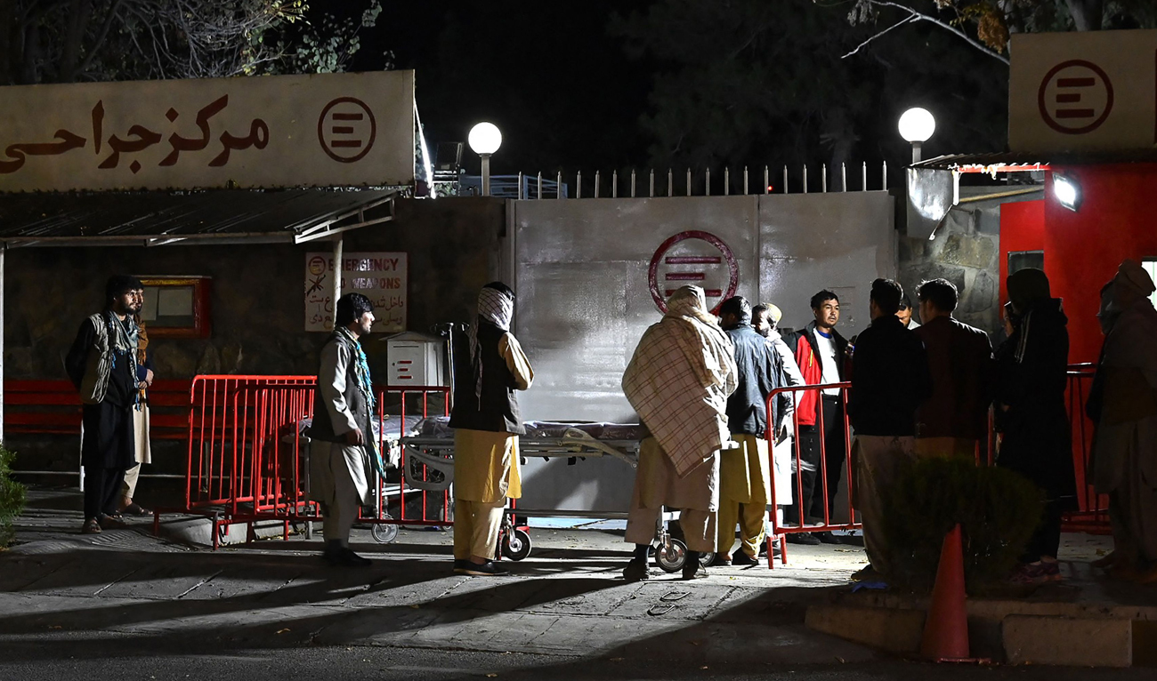 Relatives of blast victims gather outside the Italian aid organisation 'Emergency' hospital in Kabul on November 7, 2023, following an explosion on a bus. Seven people died and 20 others were injured in a bus explosion in the Afghan capital on November 7, police said. (AFP)