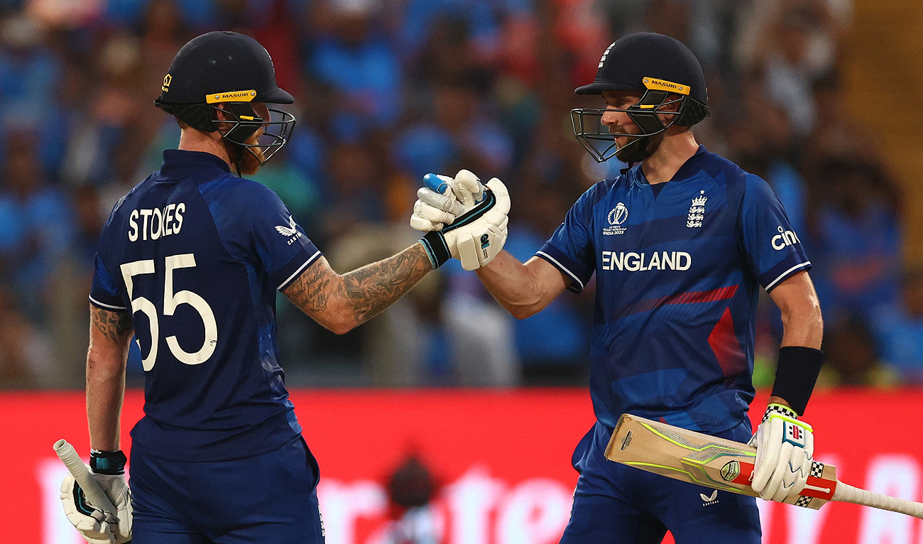 England's Ben Stokes celebrates with Chris Woakes after reaching his century during the ICC Men's Cricket World Cup match between England and Netherlands in Pune, India, Wednesday, Nov. 8, 2023. (REUTERS)