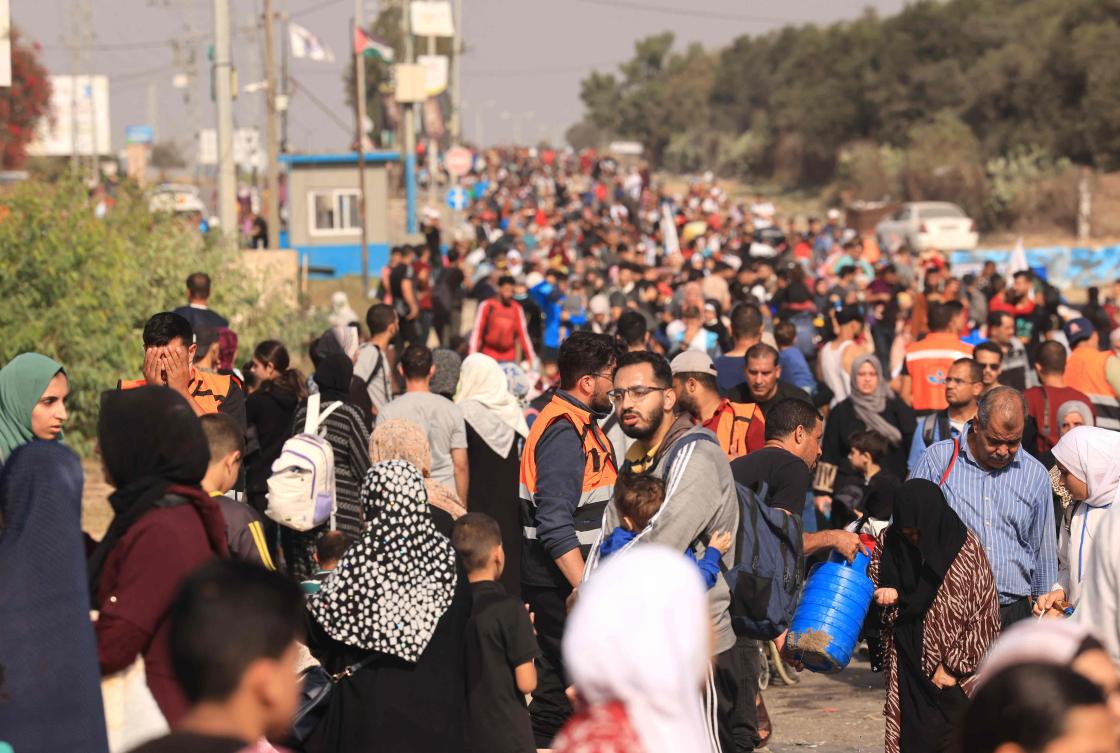 Palestinians fleeing Gaza City and other parts of northern Gaza toward the southern areas, walk along a highway on Nov. 9, 2023. An influencer was arrested in France on Thursday for making light of the reported killing of an Israel baby by Hamas attackers, prosecutors said. (AFP)