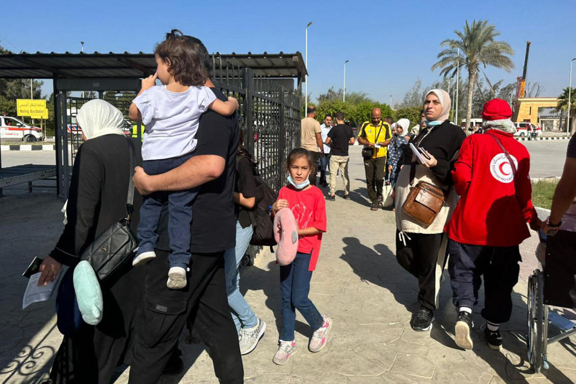 People cross into Egypt’s Rafah border crossing with the Gaza Strip, on Nov. 9, 2023, amid the ongoing battles between Israel and the Palestinian group Hamas. (AFP)