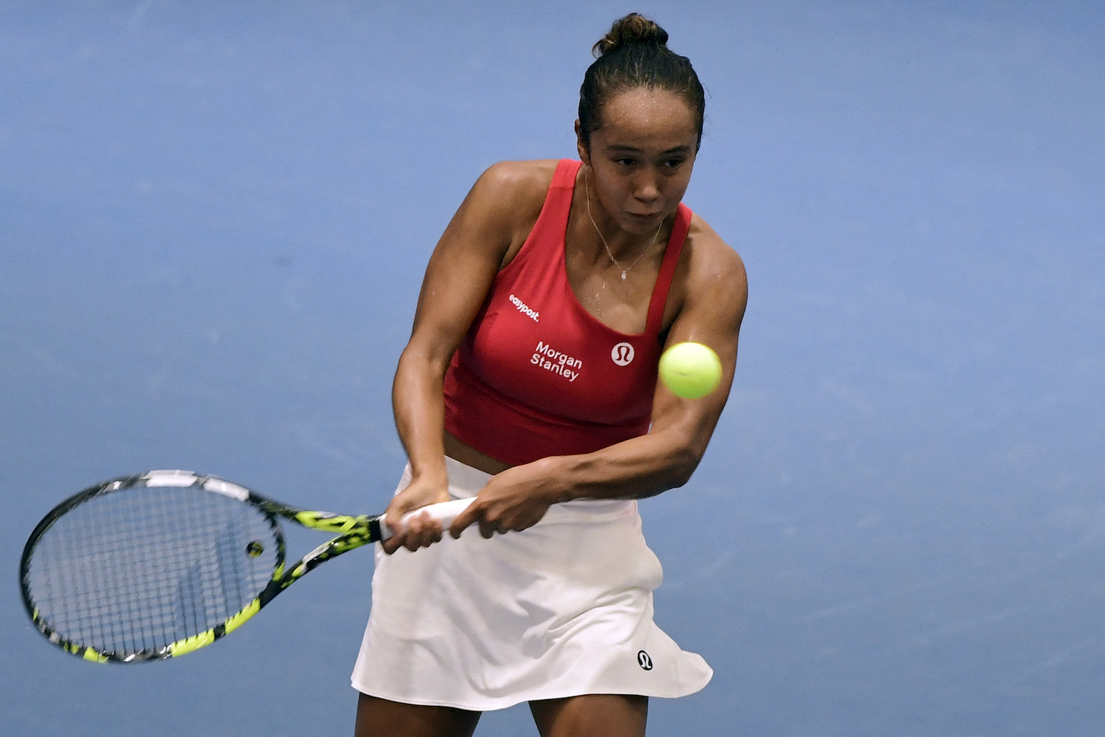 Canada's Leylah Fernandez returns the ball to Poland's Magda Linette during their group stage singles tennis match at the Billie Jean King Cup Finals 2023 in La Cartuja stadium in Seville on Thursday. (AFP)