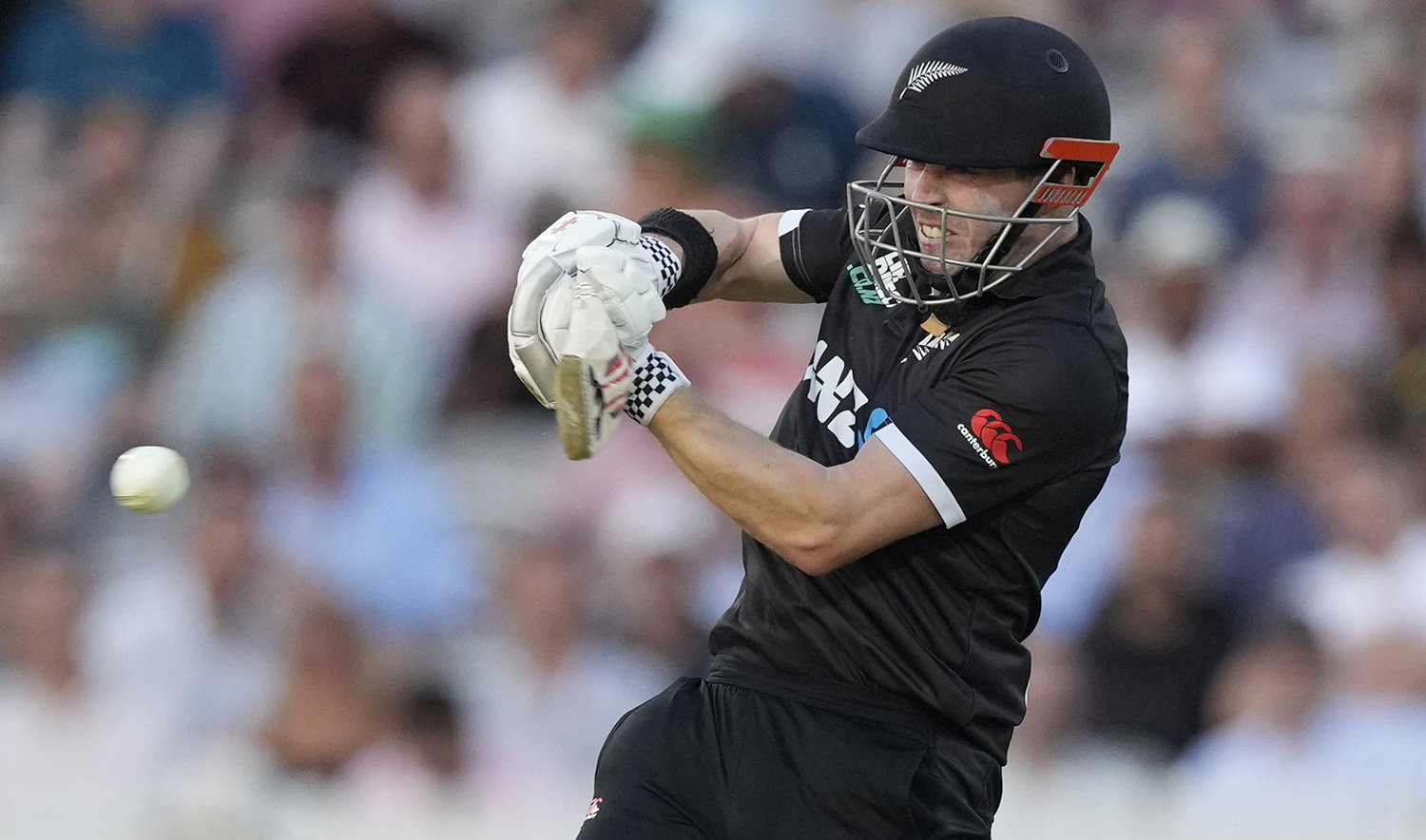 New Zealand's Henry Nicholls plays a shot off the bowling of England's Reece Topley during the One Day International cricket match between England and New Zealand at Lord's cricket ground in London, on September 15, 2023. (AP)