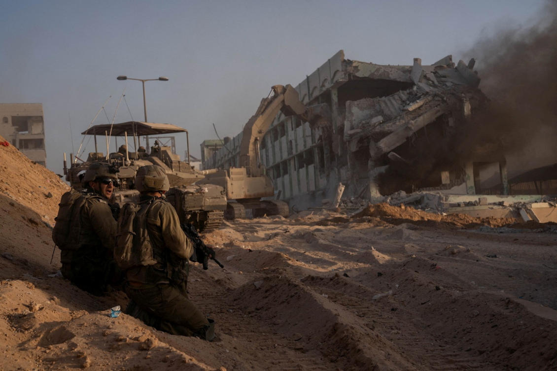 Israeli soldiers hold a position amid the ongoing ground operation of the Israeli army against the Palestinian Islamist group Hamas, in Gaza, on Nov. 8, 2023. (Reuters)