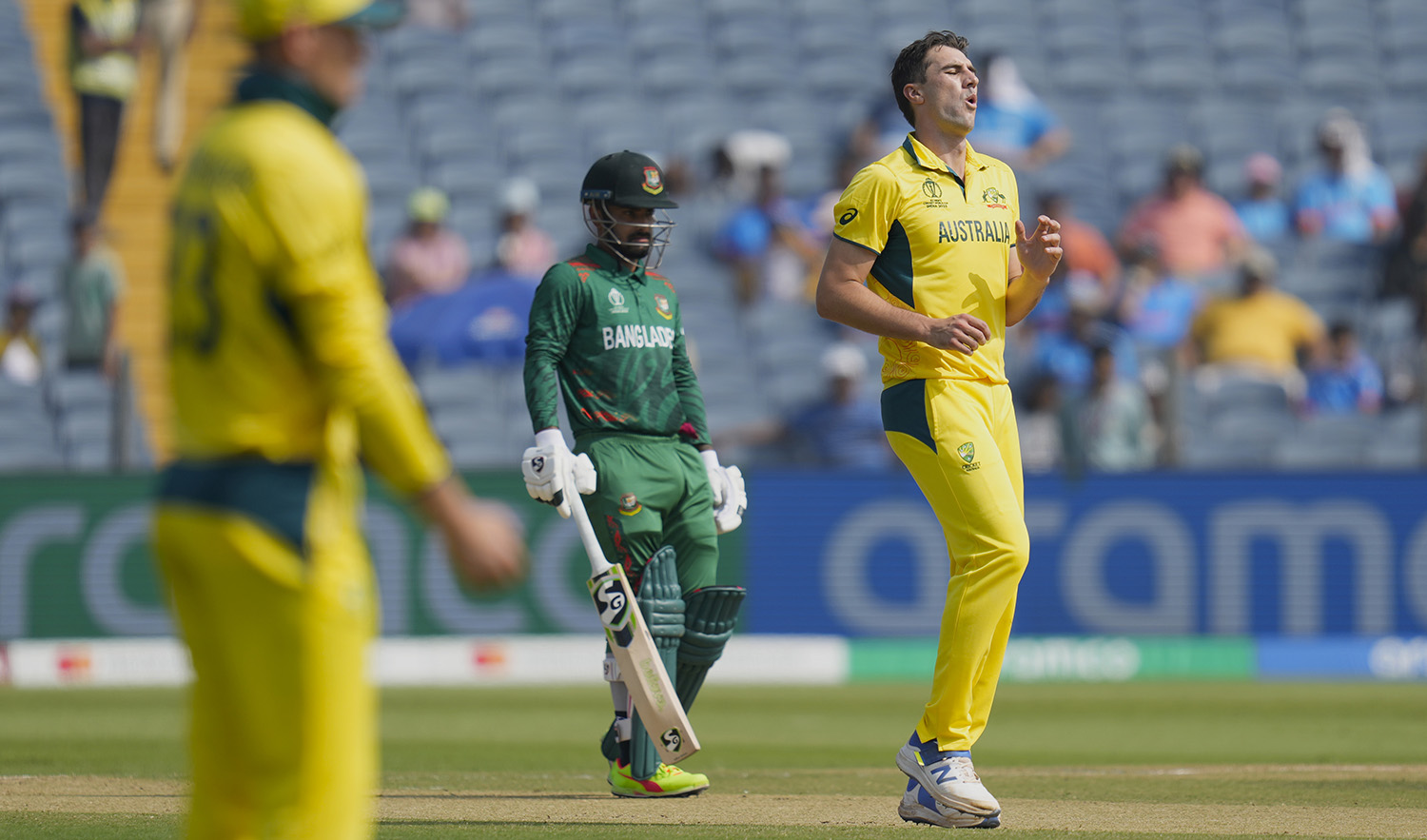 Australia's captain Pat Cummins reacts after a delivery during the ICC Men's Cricket World Cup match between Australia and Bangladesh in Pune, India, on November 11, 2023. (AP)