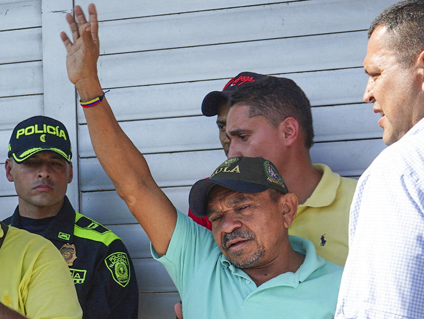 Luis Manuel Diaz, father of Liverpool’s forward Luis Diaz, waves to neighbors on his arrival to his home after being liberated in Barrancas, Colombia on Nov. 9, 2023. (AFP)
