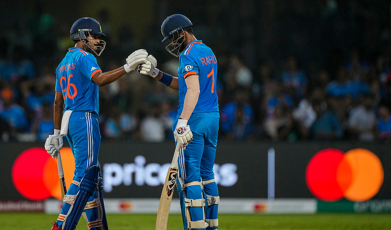 India's KL Rahul celebrates his century with India's Shreyas Iyer, left, during the ICC Men's Cricket World Cup match between India and Netherlands in Bengaluru, India, Sunday, Nov. 12, 2023. (AP)