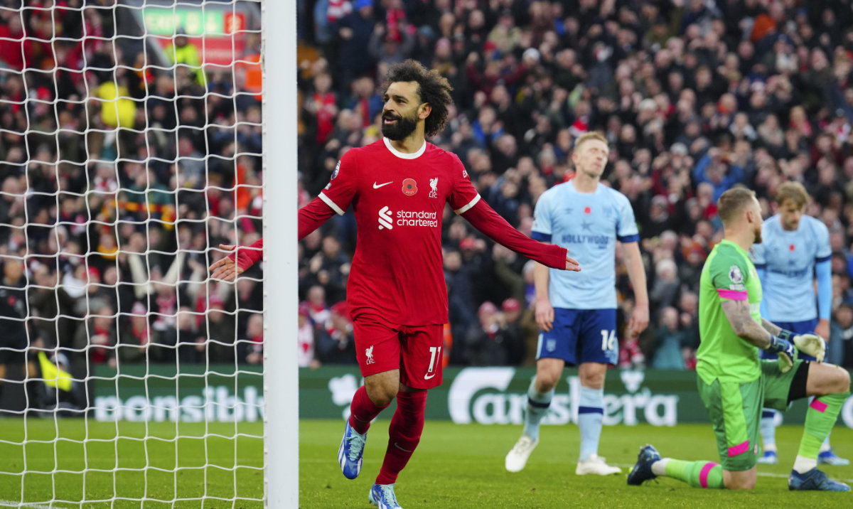Liverpool's Mohamed Salah celebrates scoring his side's opening goal during the English Premier League soccer match between Liverpool and Brentford at Anfield stadium in Liverpool, England, Sunday, Nov. 12, 2023. (AP)