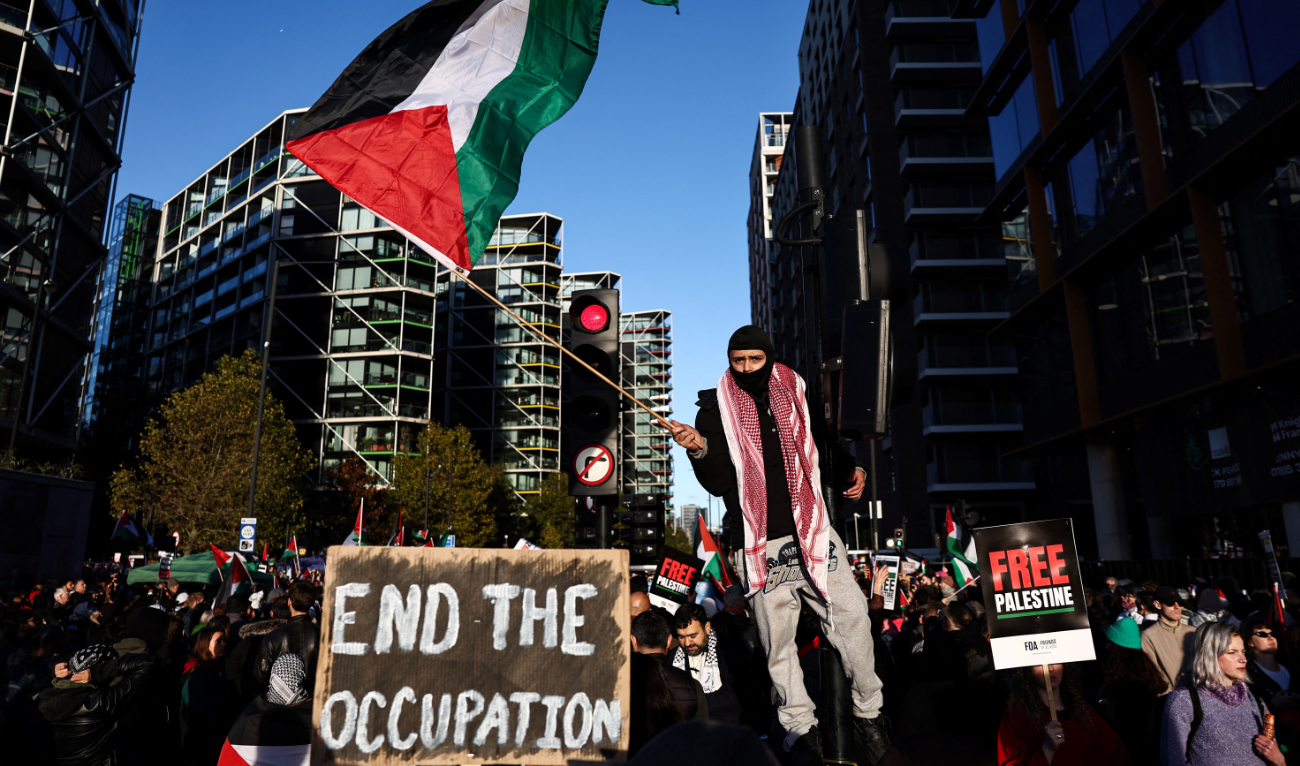 Protesters holding placards and flags take part in the 'National March For Palestine' in central London on November 11, 2023, calling for a ceasefire in the conflict between Israel and Hamas. (AFP)