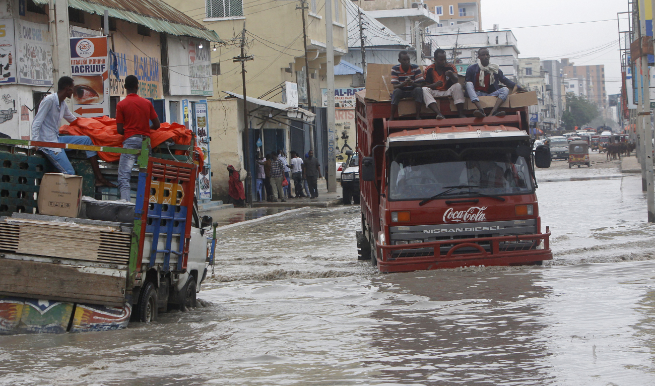 Vehicles try to maneuver through flood water caused by heavy rain in Mogadishu, Somalia on Saturday, Nov. 11, 2023. (AP)