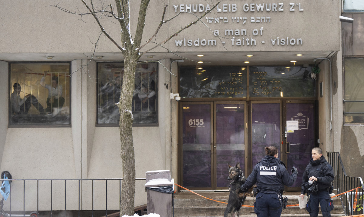 Police investigate the Yeshiva Gedolah school for clues after shots were fired, Thursday, Nov. 9, 2023 in Montreal. (AP)