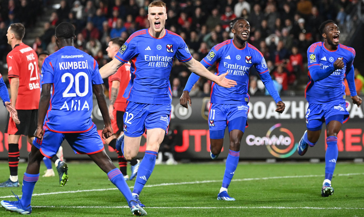 Lyon's Irish defender #12 Jake O Brien (2ndL) celebrates after scoring a goal during the French L1 football match between Stade Rennais FC and Olympique Lyonnais (OL) at the Roazhon Park Stadium in Rennes on Sunday. (AFP)