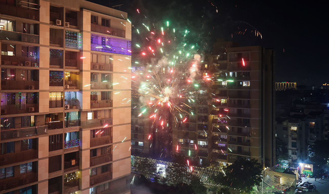 Fireworks explode in front of a residential building to celebrate Diwali, the Hindu festival of lights, in Ahmedabad, India, on November 12, 2023. (REUTERS)