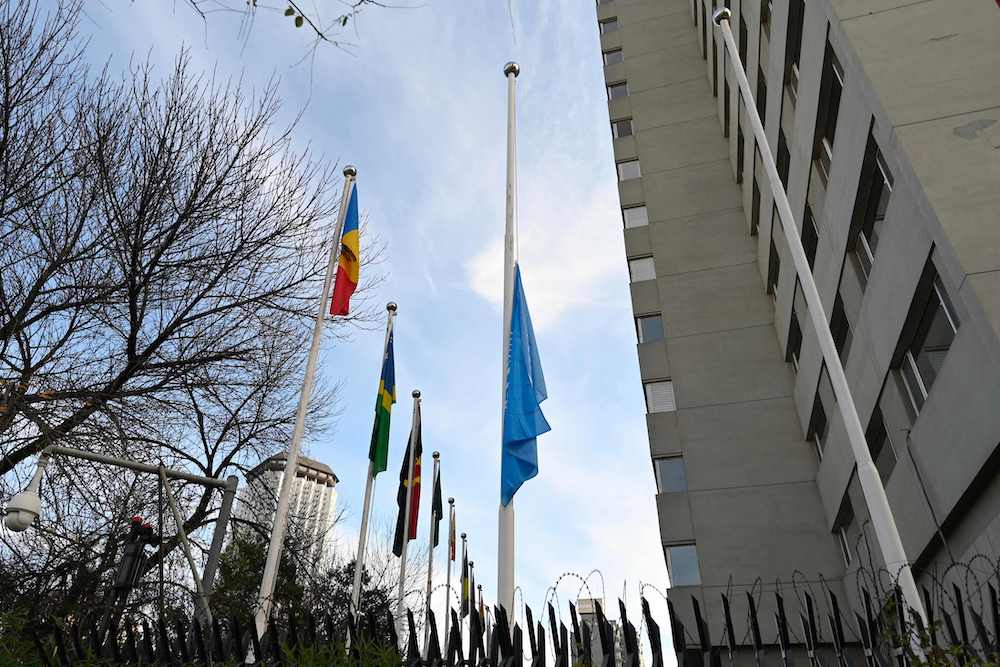 A United Nations flag flies at half-mast in front of its building in Beijing on Nov. 13, 2023. (AFP)