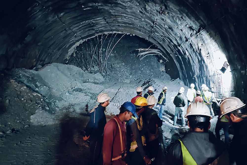 Rescue workers gather at the site after a tunnel collapsed in the Uttarkashi district of India’s Uttarakhand state. Accidents on large infrastructure construction sites are common in India. (AFP)