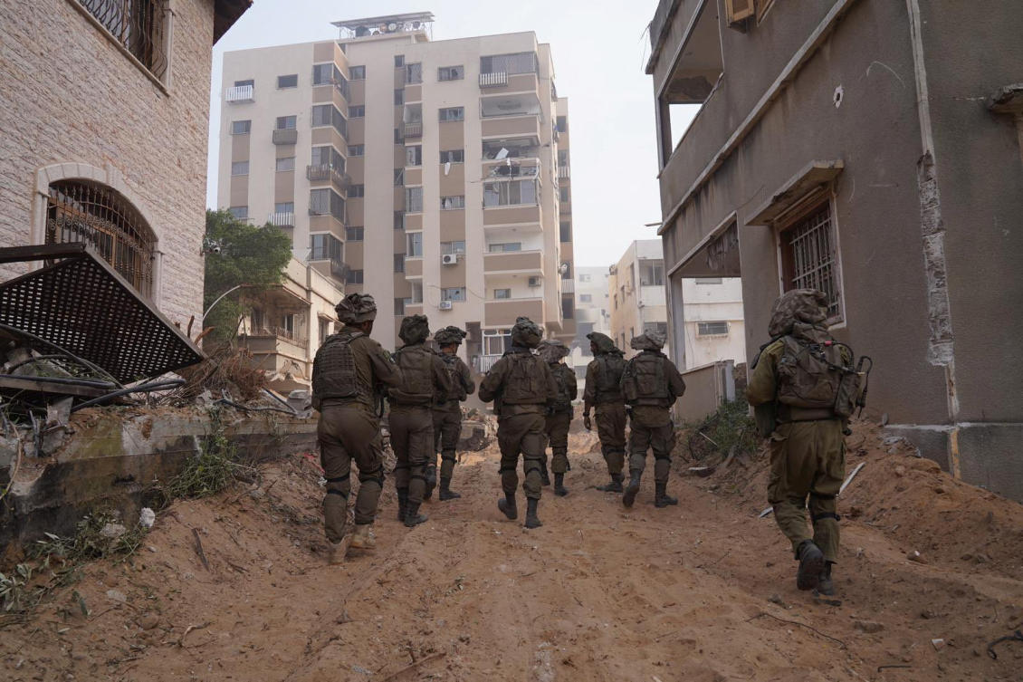 Above, Israeli soldiers during the ongoing ground operation in the Gaza Strip on Nov. 13, 2023. (Israel Defense Forces via Reuters)