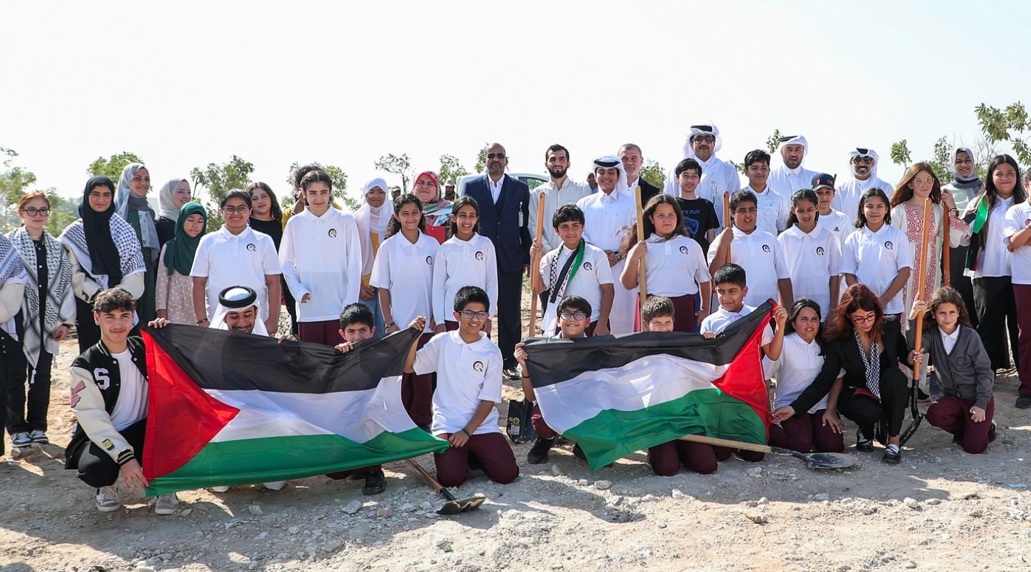 Students raise the Palestinian flag in Gaza Garden within Qatar's Education City. (Qatar Living)