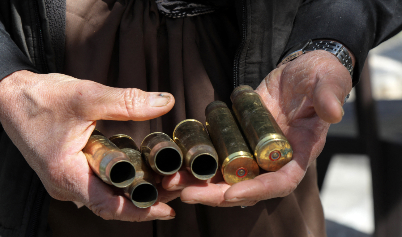 Moustafa Ahmed shows empty bullet shells collected after one of the many firefights near his home close to the Turkish border in northern Iraq’s autonomous Kurdish region between the Turkish army and fighters from the Kurdistan Workers’ Party (PKK). (AFP/File)
