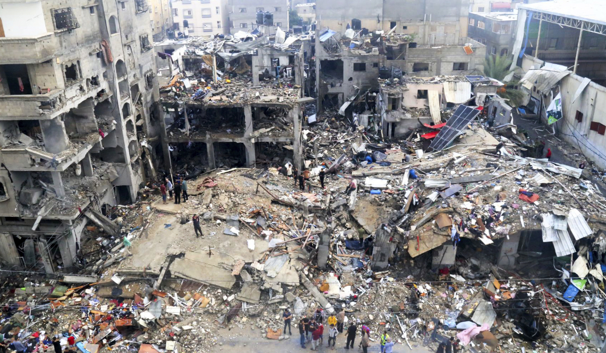 Palestinians look for survivors after an Israeli strike on a building last night in Jebaliya refugee camp, Gaza Strip, Tuesday, Nov. 14, 2023. (AP)