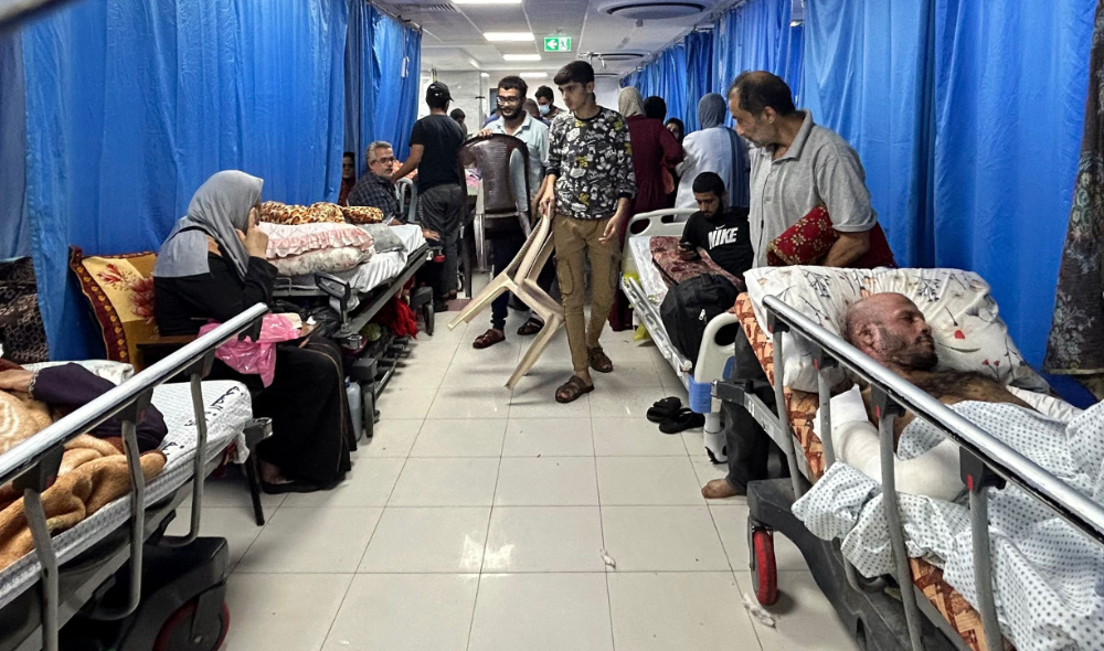 Patients and internally displaced people at Al-Shifa hospital in Gaza City. (AFP)