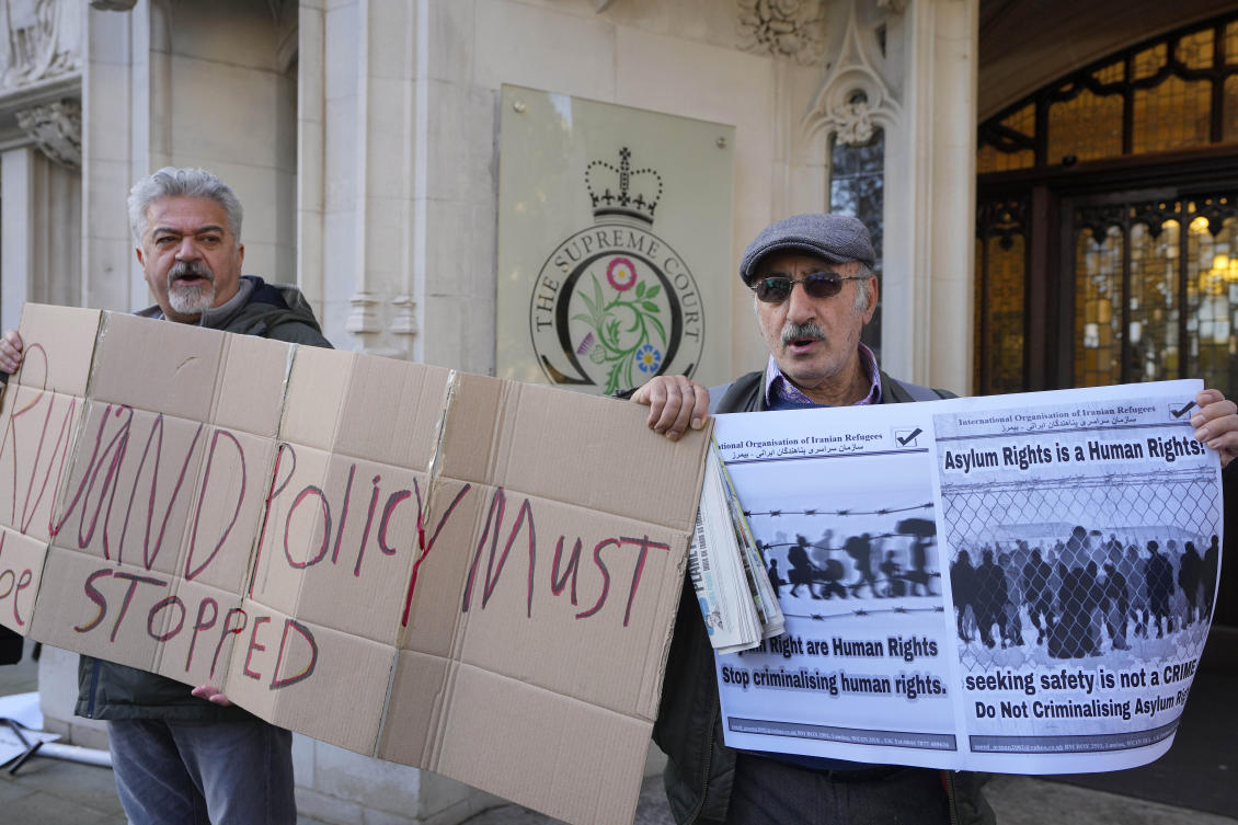 Above, protesters stand outside the Supreme Court in London on Nov. 15, 2023. Britain’s highest court is set to rule Wednesday, Nov. 15. The high court’s ruling dealt a massive blow to Prime Minister Rishi Sunak’s immigration policy. (AP)