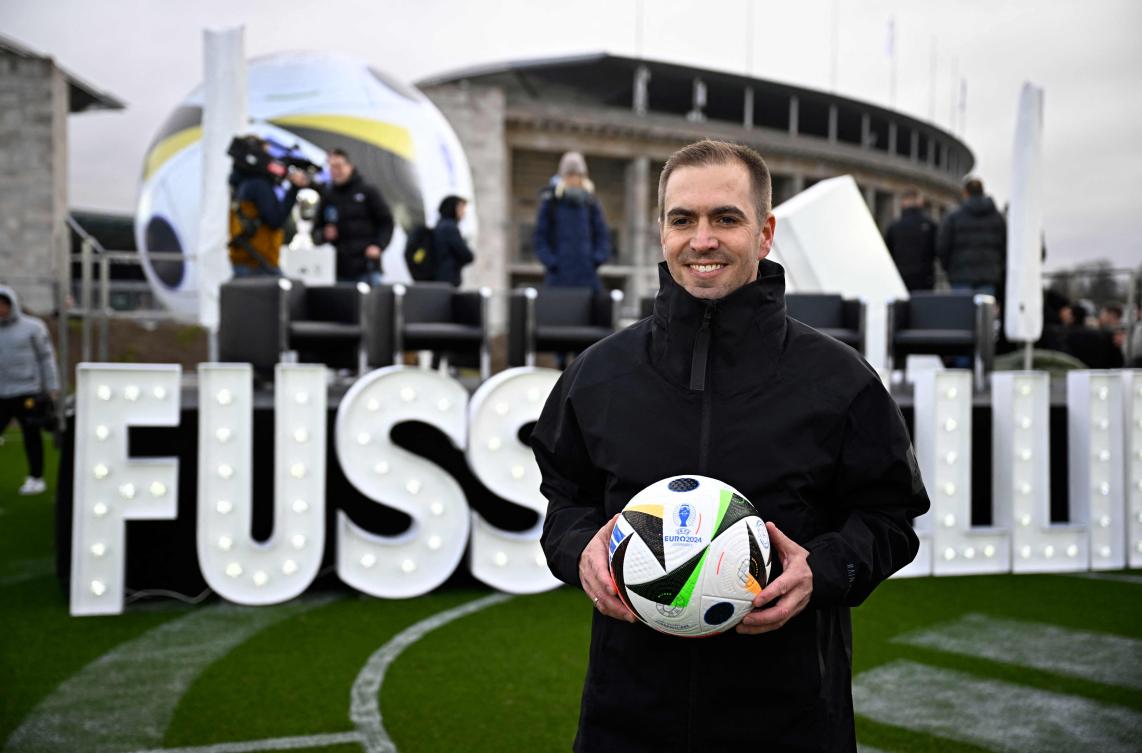 German former football player Philipp Lahm, also head of Germany’s 2024 European Championship organizing committee, holds the official ball on Nov. 15, 2023 at the Olympic Stadium in Berlin, Germany, during an event organized by sports equipment maker Adidas to present the official ball for 2024 UEFA European Football Championship. (AFP)