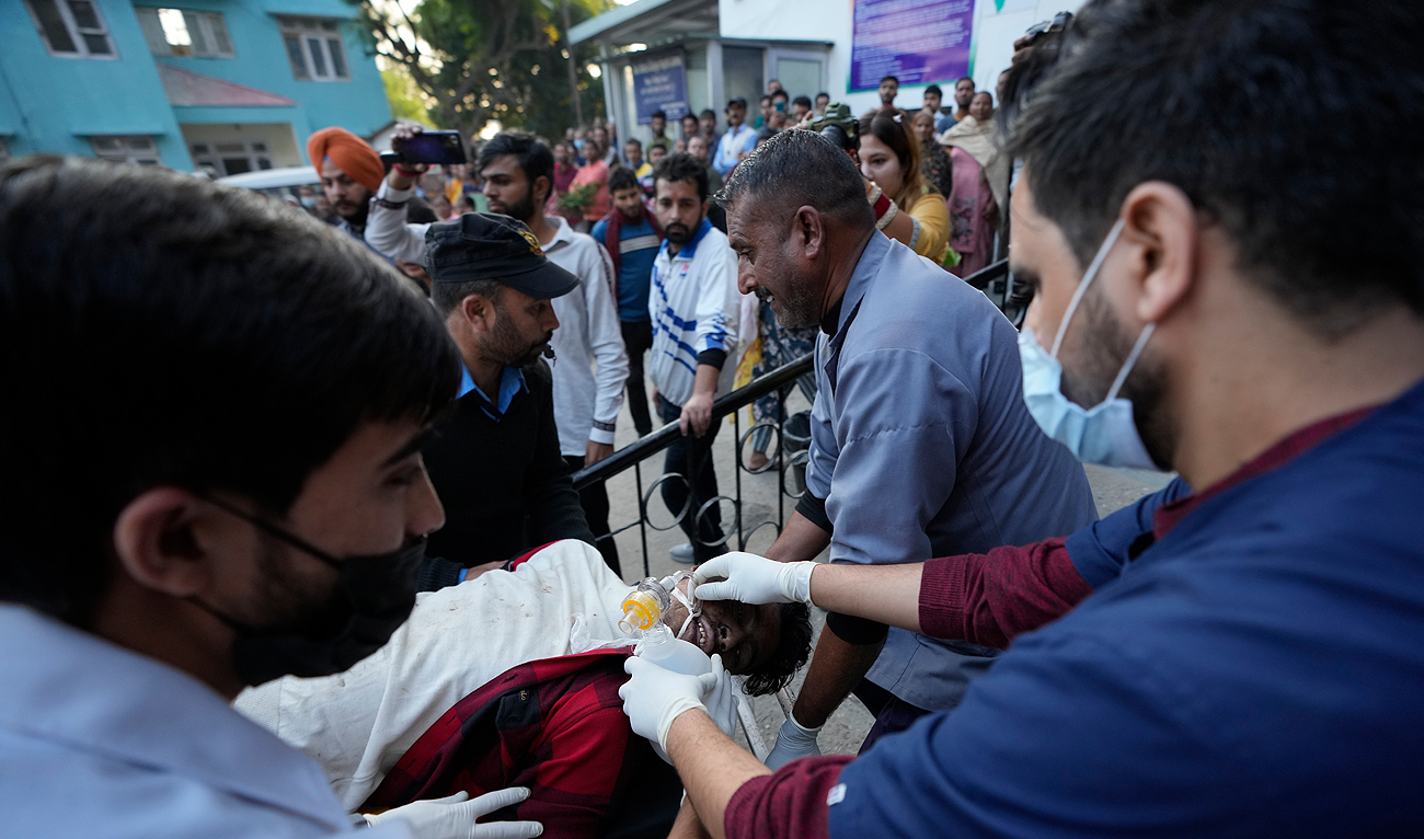 A man injured after a passenger bus slid off a Himalayan highway is brought for treatment at a government hospital in Jammu, India, Wednesday, Nov. 15, 2023. (AP)