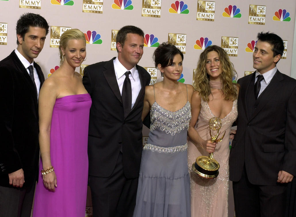 David Schwimmer, from left, Lisa Kudrow, Matthew Perry, Courteney Cox, Jennifer Aniston and Matt LeBlanc pose after “Friends” won outstanding comedy series at the 54th Primetime Emmy Awards on Sept. 22, 2002, in Los Angeles. (AP/File)