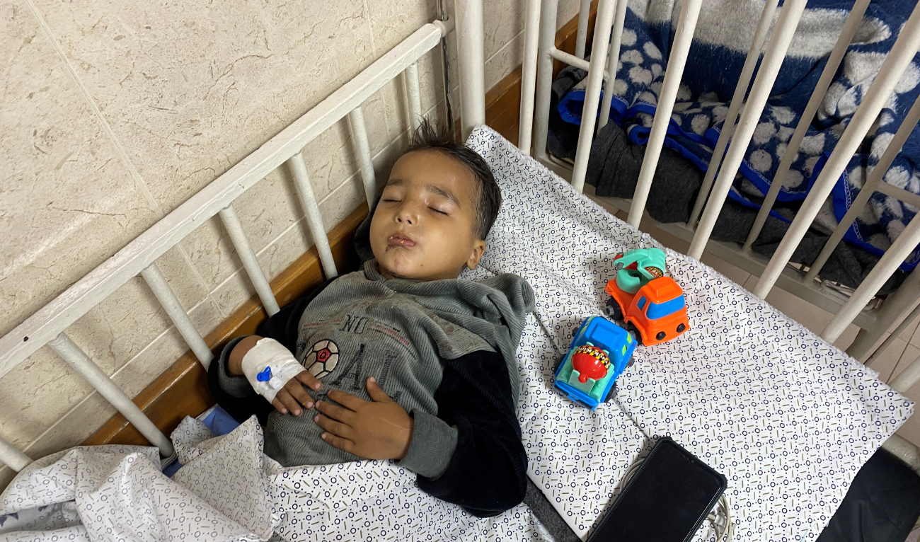 Ahmed Shabat, 4, who was subjected to two Israeli airstrikes, becoming an orphan in the first, and losing his lower limbs in the second, recovers at a hospital in Gaza. (Reuters)
