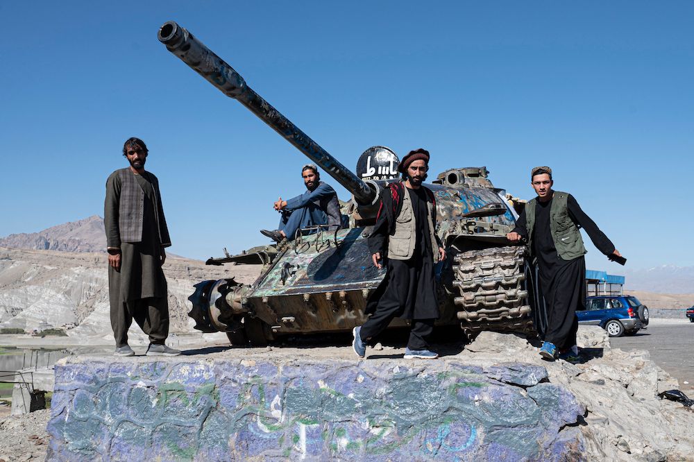 Above, Afghan men stand beside a Soviet era tank along a hill road in Surobi district of Kabul province. A BBC program previously reported that between December 2010 and May 2011, one British special forces squadron was responsible for the deaths of 54 people in Afghanistan. (AFP)